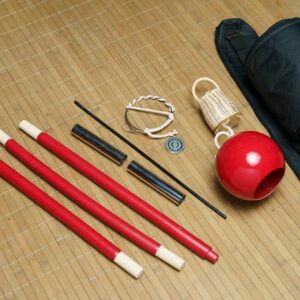 Close-up of a gunga-sized cabaca with a smooth red finish, part of a detachable berimbau set
