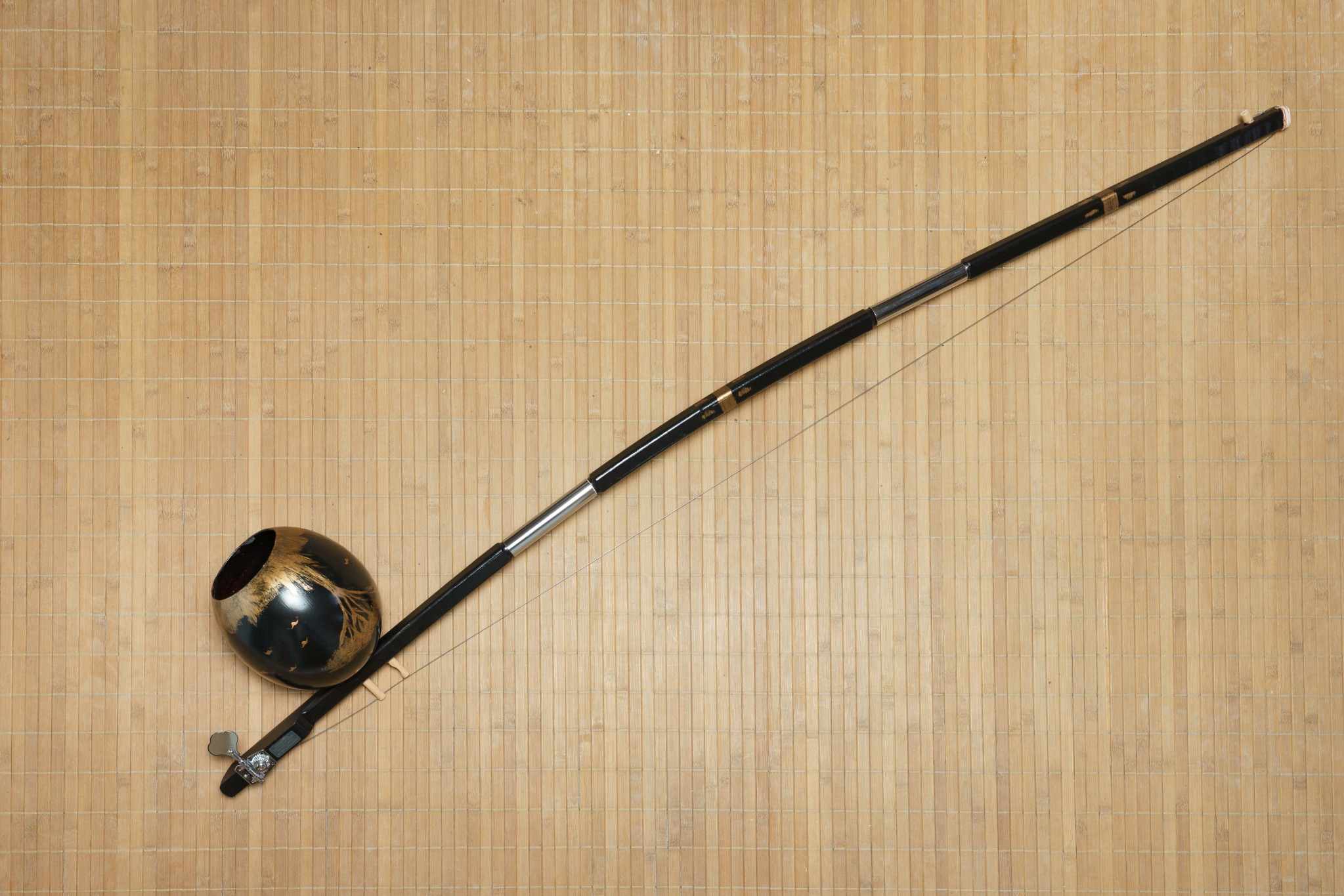 A berimbau with a modern detachable and tunable mechanism, perfect for portability